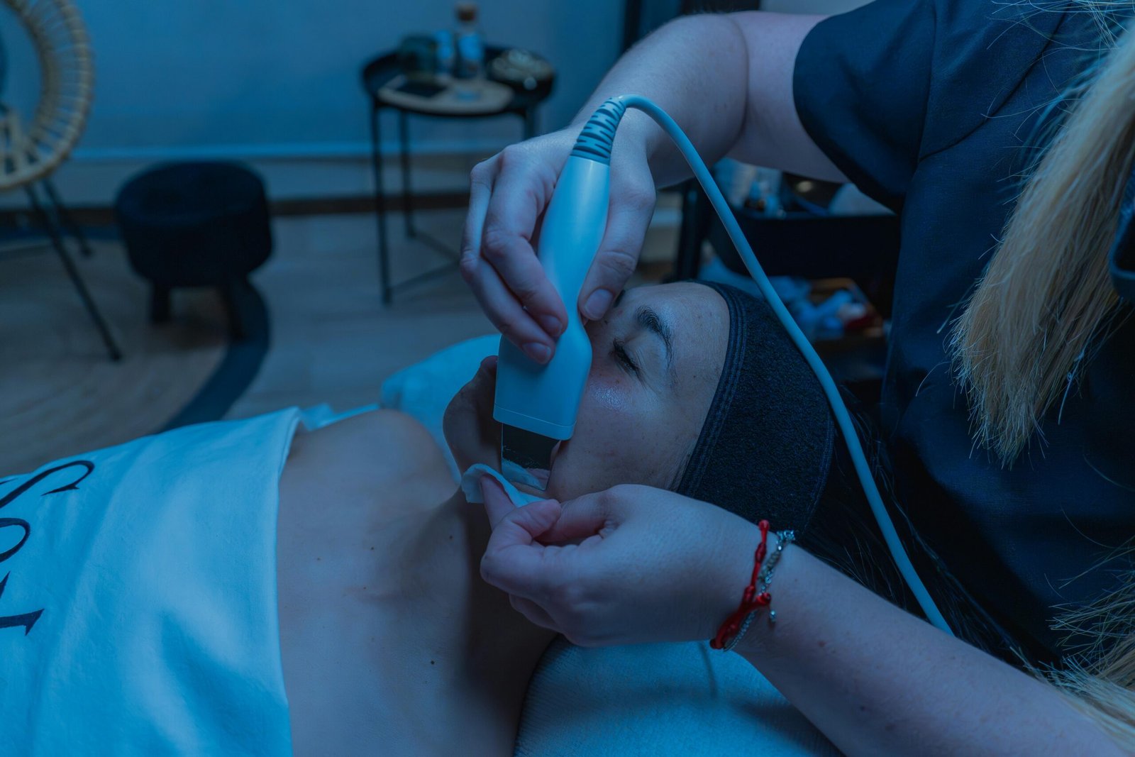 Close-up of a skincare treatment using advanced device in a spa setting.